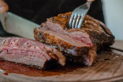 Slicing a New York strip steak