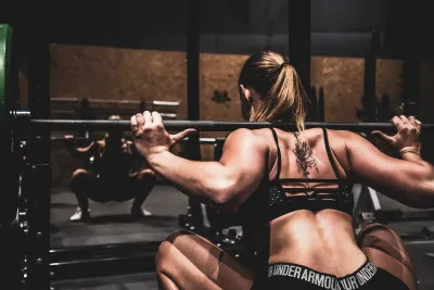 a woman doing a squat